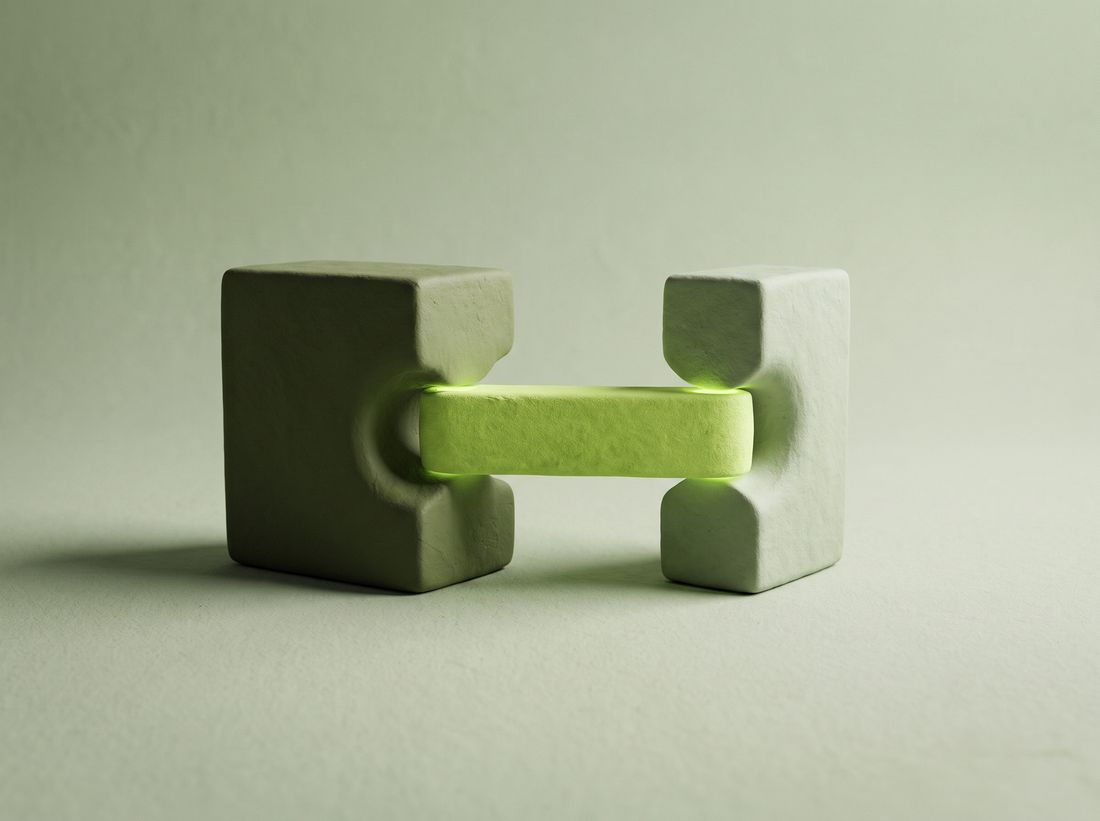 Two sculpted blocks joined by a single glowing bar